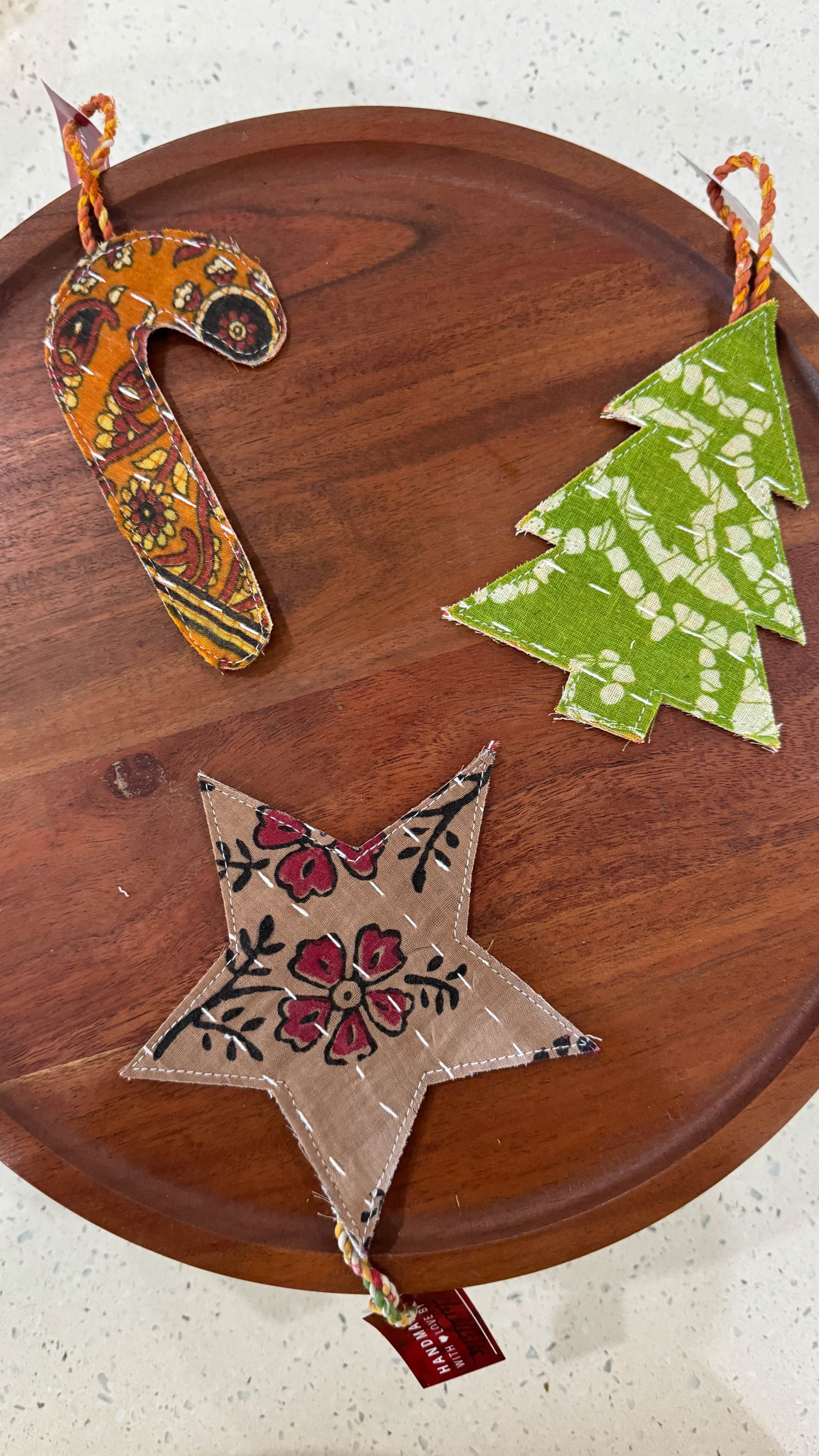 a wooden table topped with ornaments on top of it