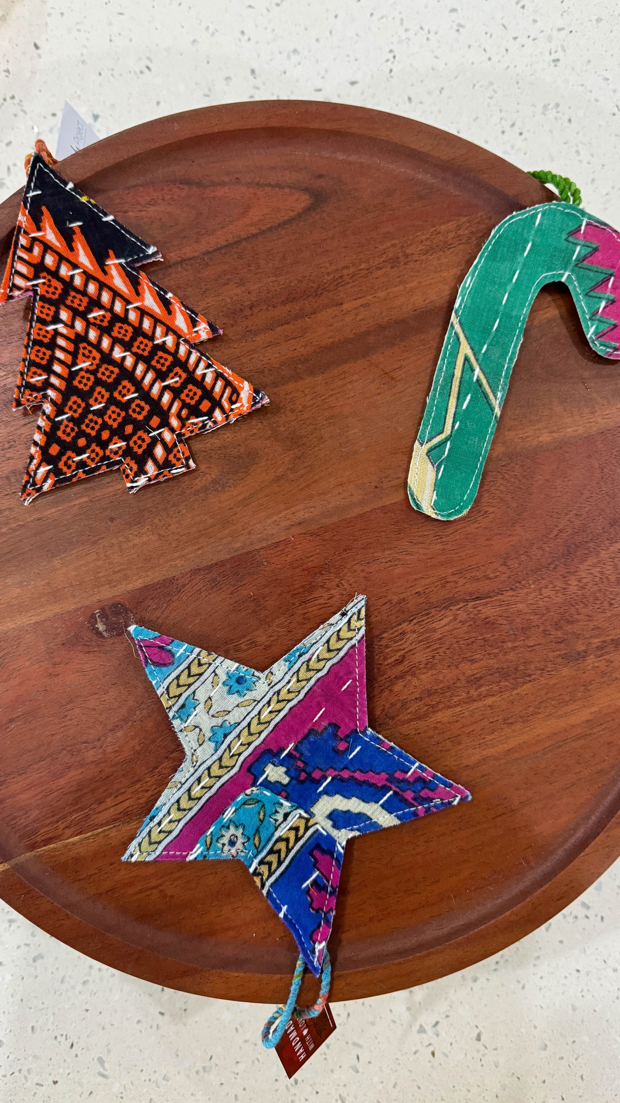 a wooden table topped with different types of kites