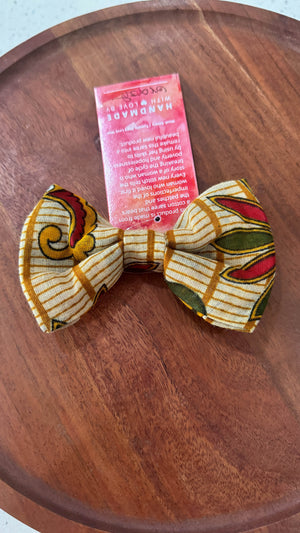 a bow tie sitting on top of a wooden table