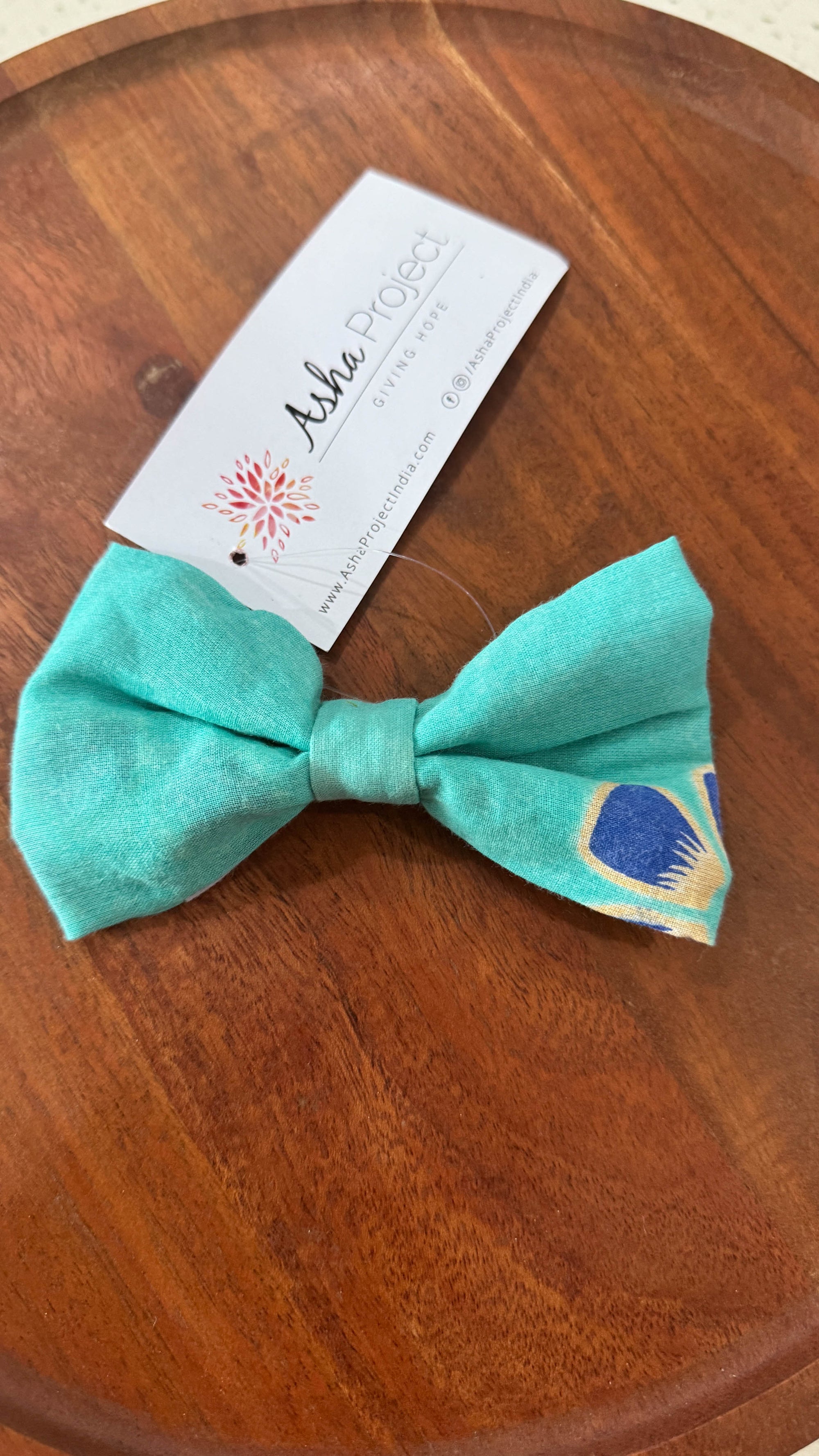 a bow tie sitting on top of a wooden table