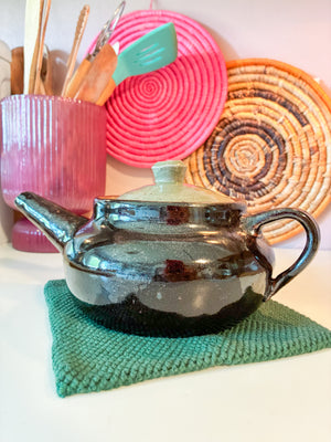 Fair trade crocheted trivet made with thick cotton yarn, ideal for cooking, baking, and everyday kitchen tasks.