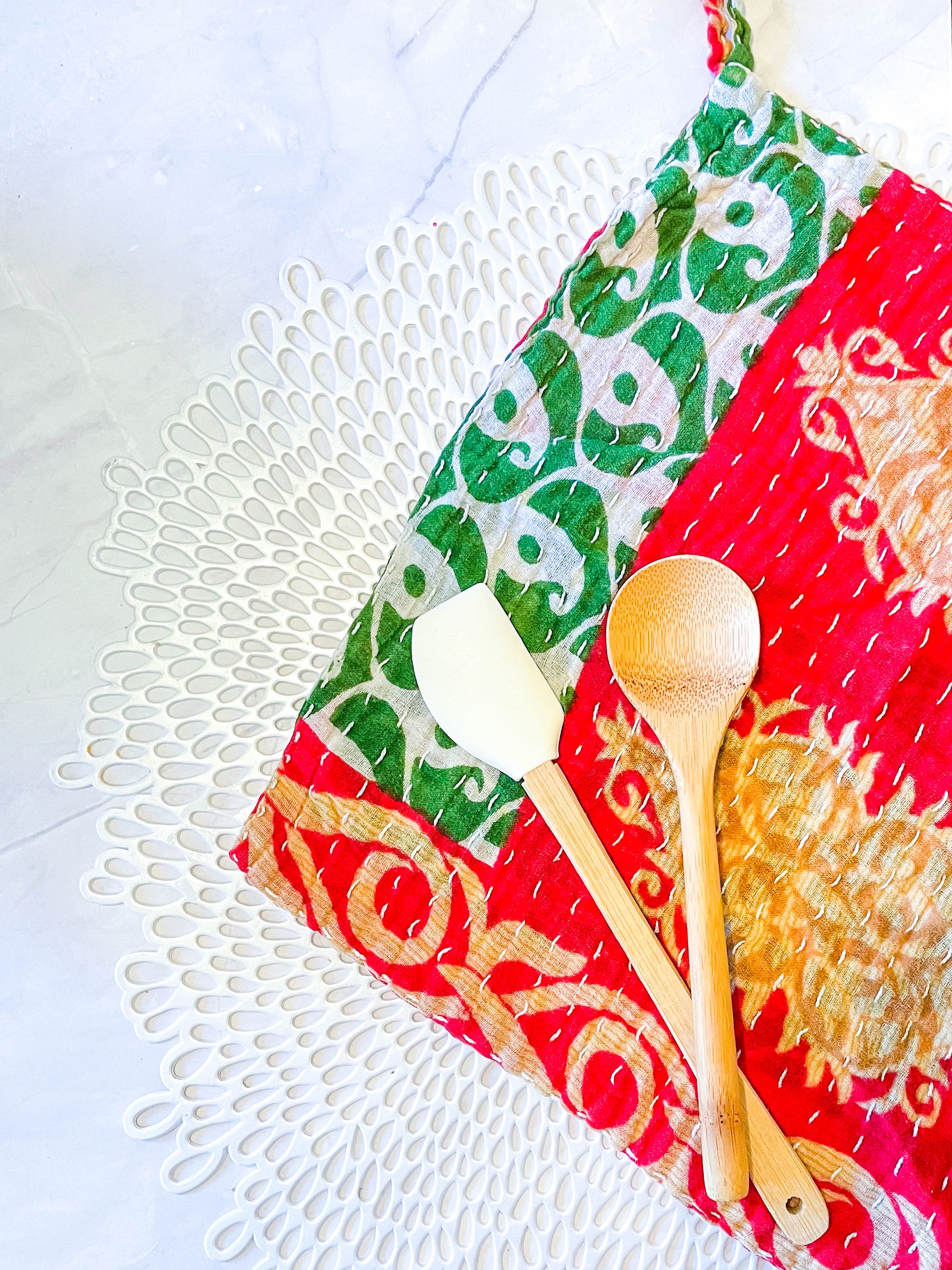 Kantha dish cloths made from hand-stitched, colorful fabric, perfect for eco-friendly cleaning and adding a vibrant touch to your kitchen during the Christmas Season. 