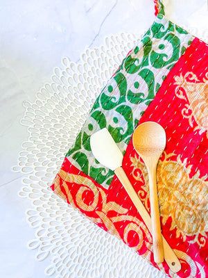 Kantha dish cloths made from hand-stitched, colorful fabric, perfect for eco-friendly cleaning and adding a vibrant touch to your kitchen during the Christmas Season. 