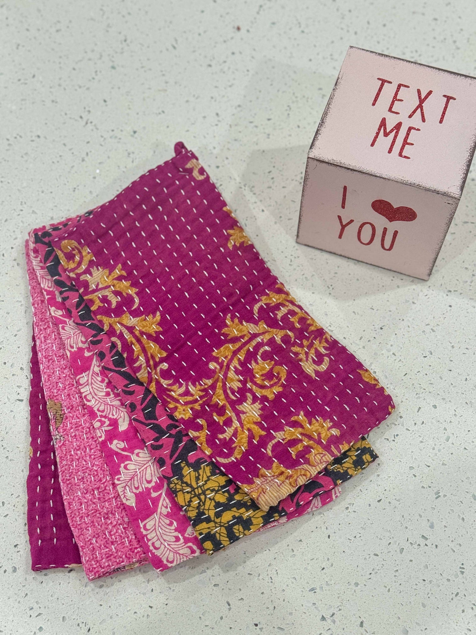 Kantha dish cloths made from hand-stitched, colorful fabric, perfect for eco-friendly cleaning and adding a vibrant touch to your kitchen during Valentines.
