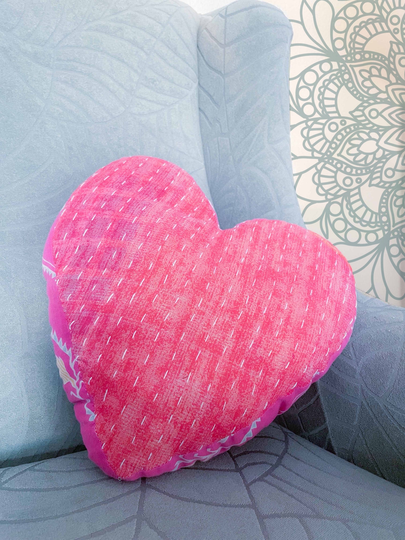 Handmade Kantha heart pillow with vibrant stitching and colorful saree patterns, perfect as a throw pillow for your bed or couch, adding a touch of traditional style and comfort to any room.