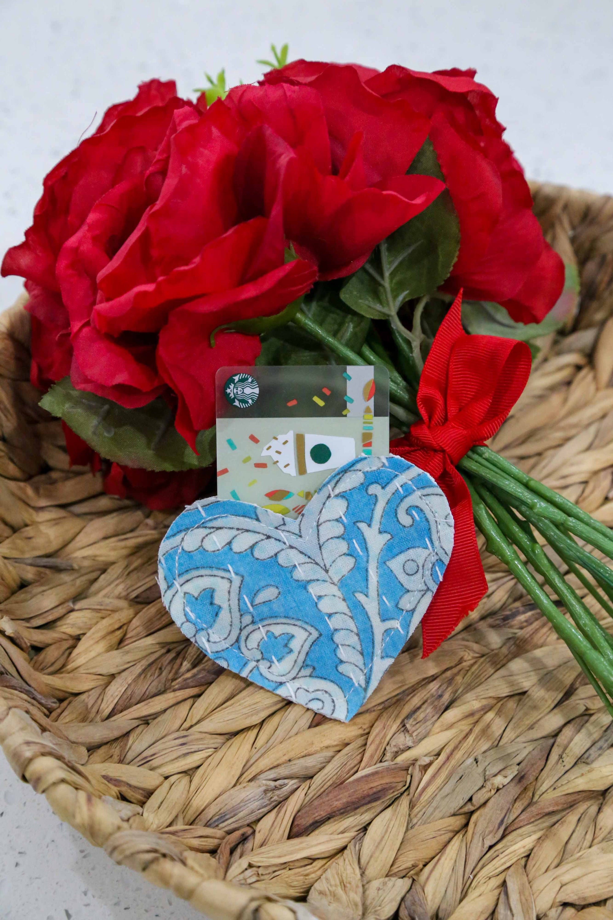 Kantha heart pouch, small enough to fit in the palm of your hand, perfect for holding trinkets, chocolates, jewelry, or gift cards, featuring vibrant saree patterns.