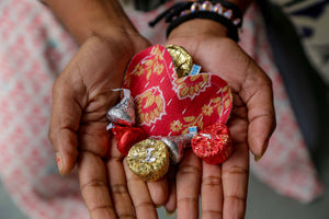 Kantha heart pouch, small enough to fit in the palm of your hand, perfect for holding trinkets, chocolates, jewelry, or gift cards, featuring vibrant saree patterns.