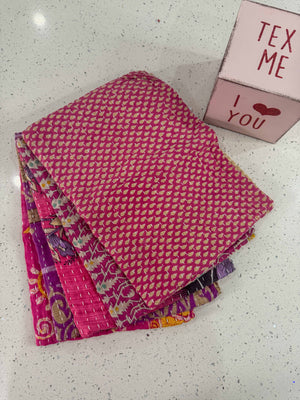 Kantha kitchen towels made from hand-stitched, colorful fabric, perfect for adding an eco-friendly and vibrant touch to your kitchen while offering practical use.