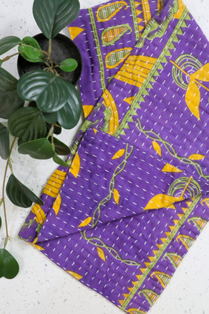 Kantha kitchen towels made from hand-stitched, colorful fabric, perfect for adding an eco-friendly and vibrant touch to your kitchen while offering practical use.