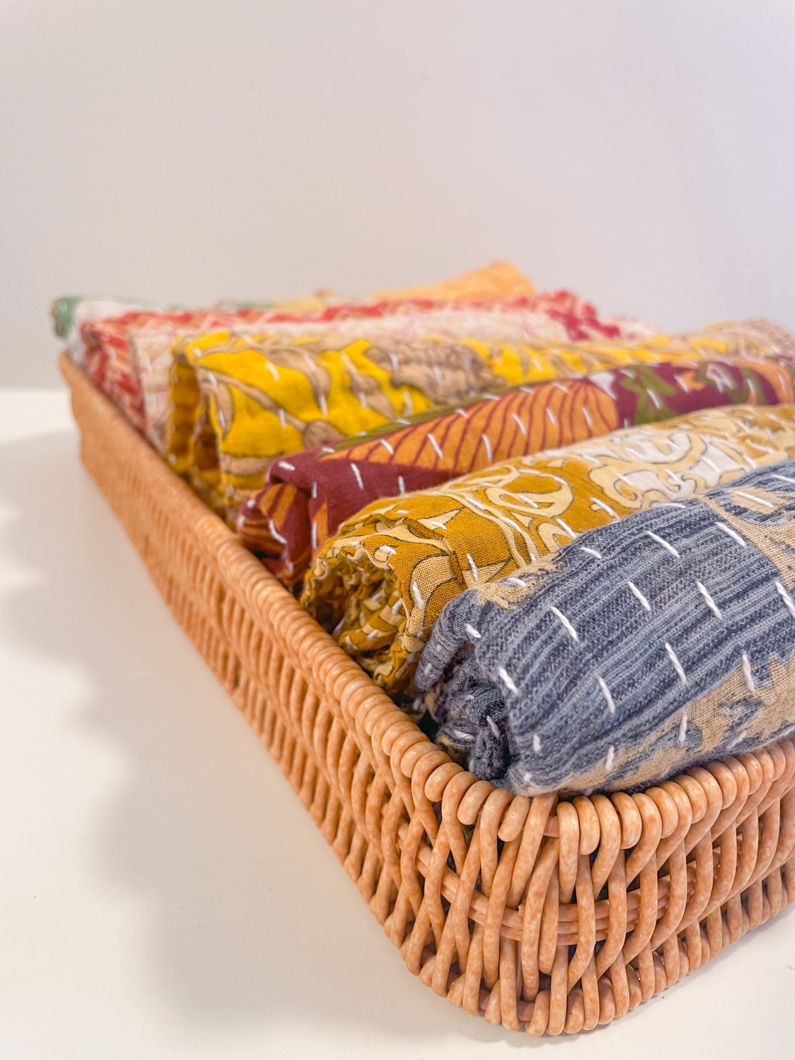 Handmade Kantha kitchen towels in rich fall colors, featuring intricate stitching and vibrant patterns, perfect for adding a seasonal touch to your kitchen while being soft and absorbent.
