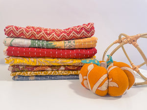 Handmade Kantha kitchen towels in rich fall colors, featuring intricate stitching and vibrant patterns, perfect for adding a seasonal touch to your kitchen while being soft and absorbent.