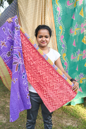Handmade Kantha Scarf crafted from recycled cotton sarees, featuring unique patchwork patterns and running stitch embroidery.