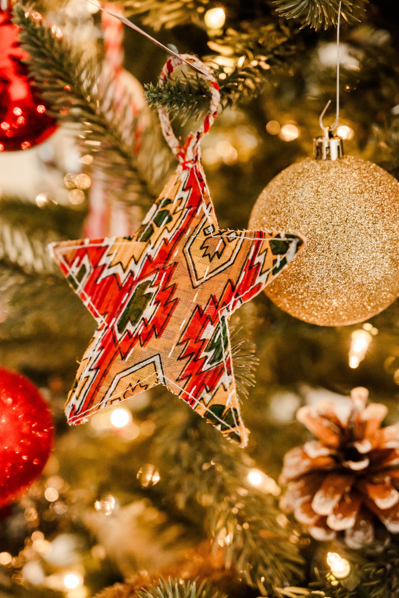 Handmade Kantha Star ornament with Kantha stitched vibrant sarees, perfect for dressing up your tree with a unique, colorful touch of traditional style this holiday season.