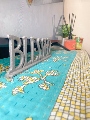 Reversible kantha table runner featuring two vibrant saree  patterns. The runner is stitched with delicate kantha embroidery, adding texture and charm to both sides.