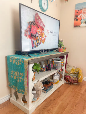 Reversible kantha table runner featuring two vibrant saree  patterns. The runner is stitched with delicate kantha embroidery, adding texture and charm to both sides.