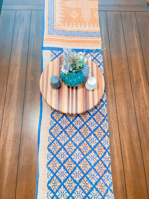 Reversible kantha table runner featuring two vibrant saree  patterns. The runner is stitched with delicate kantha embroidery, adding texture and charm to both sides.