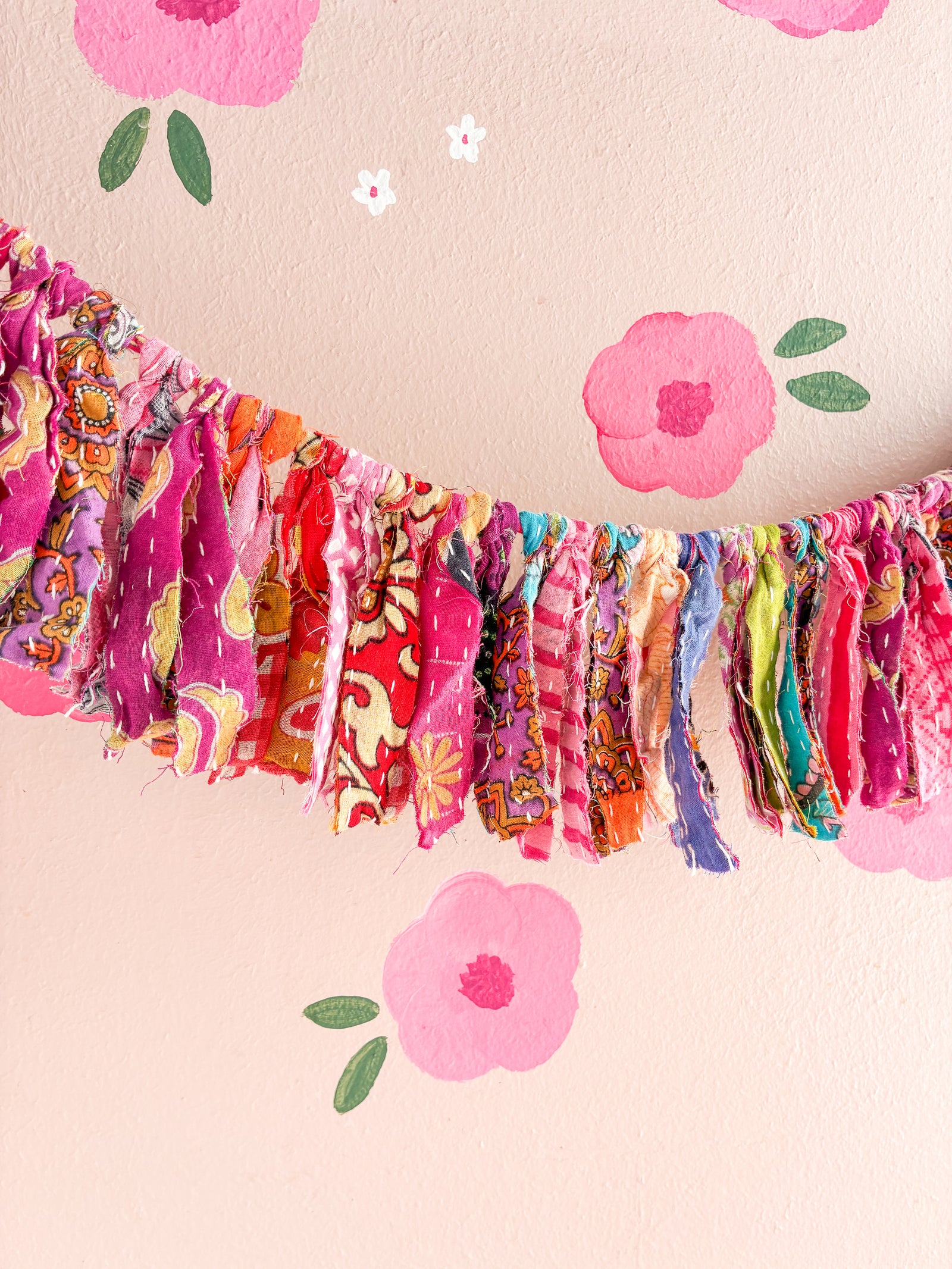 Kantha tassel garland featuring vibrant, hand-stitched fabric tassels, adding a colorful and eco-friendly touch to your home decor.