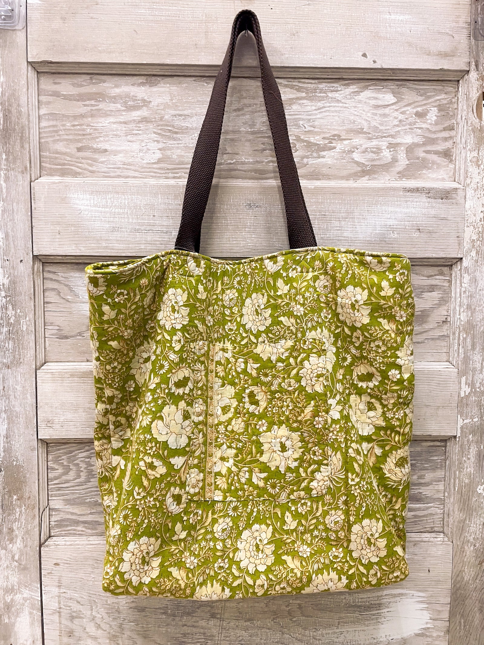 Kantha tote bag featuring hand-stitched patterns, vibrant colors, and a unique, rustic design, perfect for casual outings or as a stylish accessory