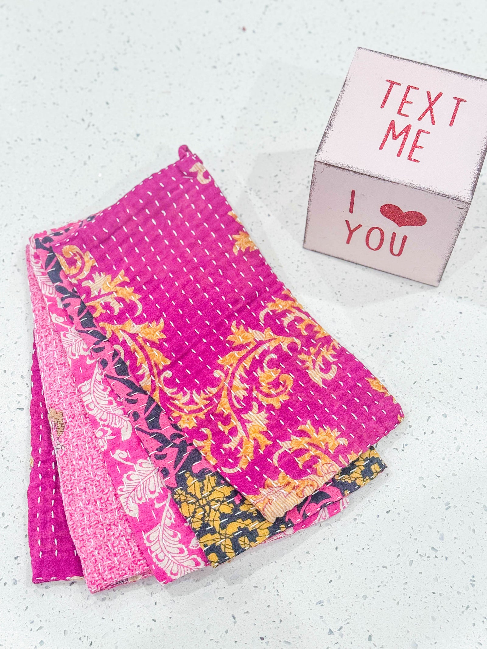 Kantha dish cloths made from hand-stitched, colorful fabric, perfect for eco-friendly cleaning and adding a vibrant touch to your kitchen during Valentines.