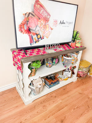 Reversible kantha table runner featuring two vibrant saree  patterns. The runner is stitched with delicate kantha embroidery, adding texture and charm to both sides.