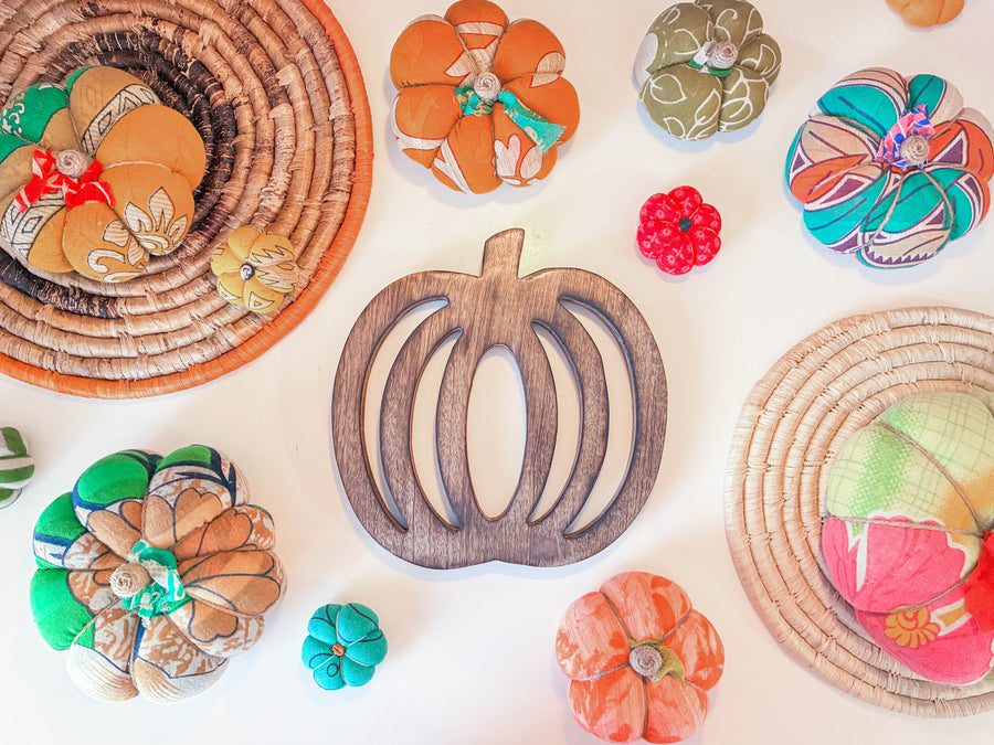Hand carved wooden pumpkin trivet for fall kitchen decor, sustainable mango wood. Farmhouse decor