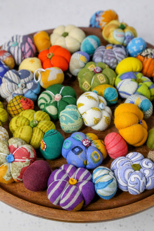 Mini saree pumpkin bead garland featuring small fabric pumpkins and colorful beads, creating a festive and eco-friendly fall or Halloween decoration.