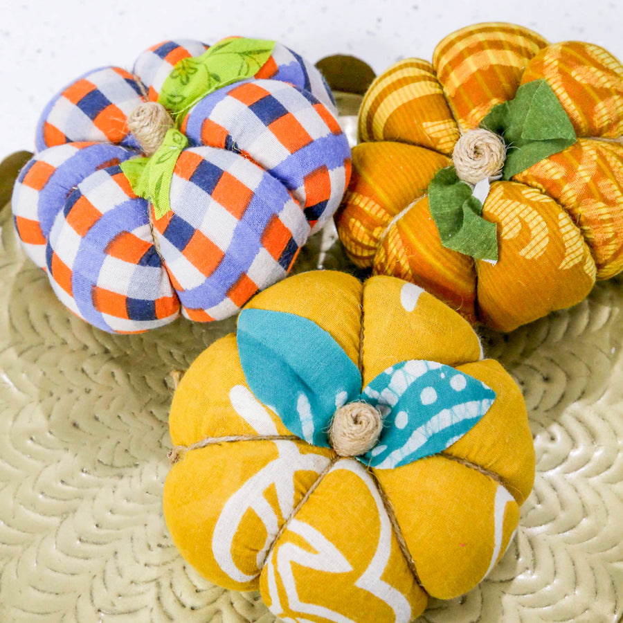 Upcycled saree pumpkin, unique autumn decoration with vibrant patterns.