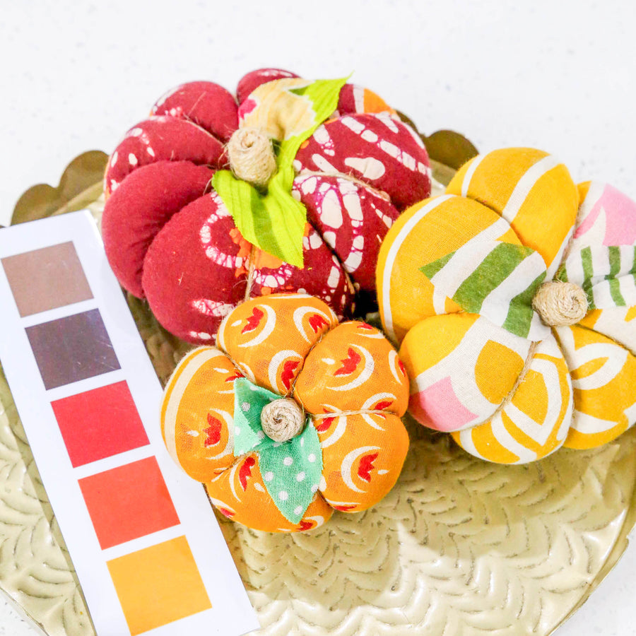 Upcycled saree pumpkin, unique autumn decoration with vibrant patterns.