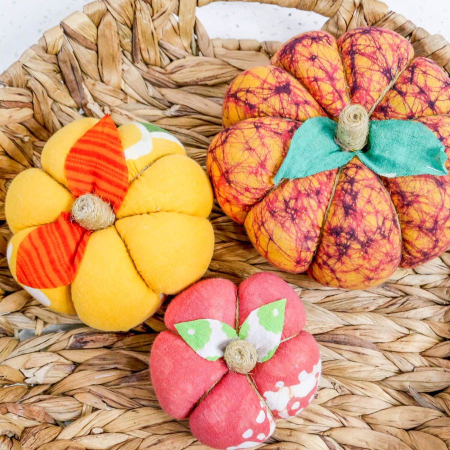 Upcycled saree pumpkin, unique autumn decoration with vibrant patterns.