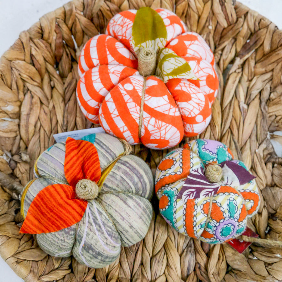 Upcycled saree pumpkin, unique autumn decoration with vibrant patterns.