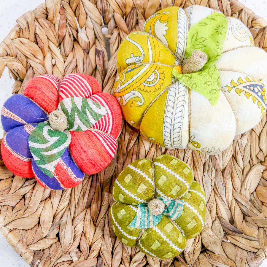 Upcycled saree pumpkin, unique autumn decoration with vibrant patterns.
