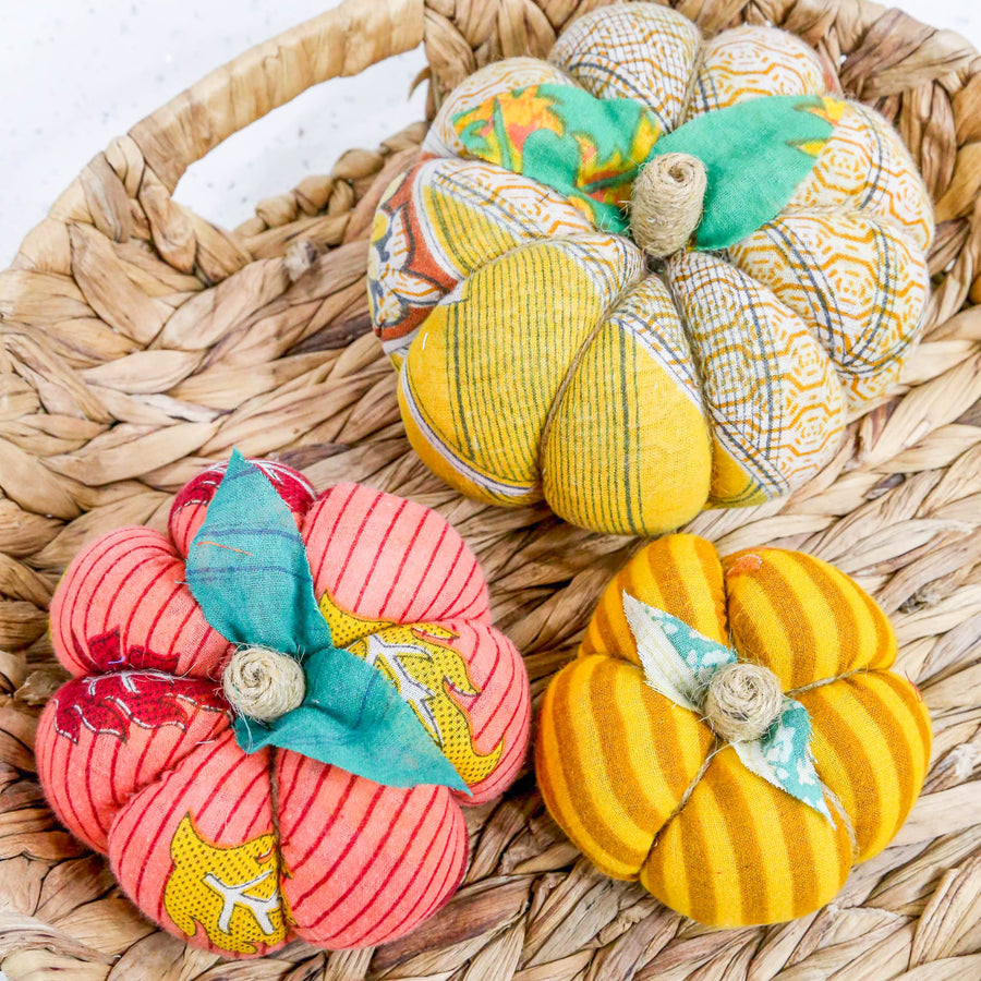 Upcycled saree pumpkin, unique autumn decoration with vibrant patterns.