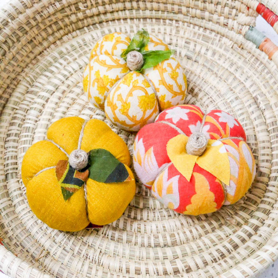 Upcycled saree pumpkin, unique autumn decoration with vibrant patterns.