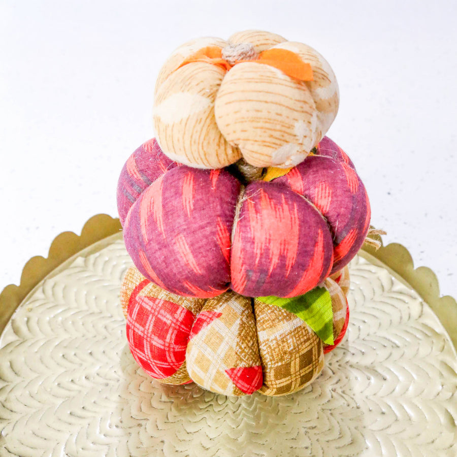 Upcycled saree pumpkin, unique autumn decoration with vibrant patterns.