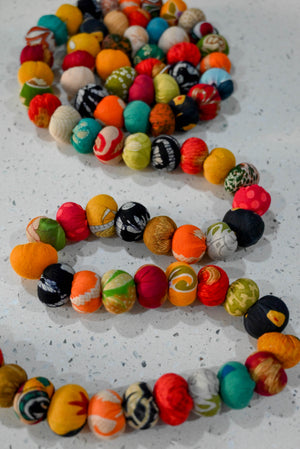 Hand-stitched Saree Bead Garland featuring vibrant, multicolored beads strung together, creating a beautiful and colorful decorative piece for home decor