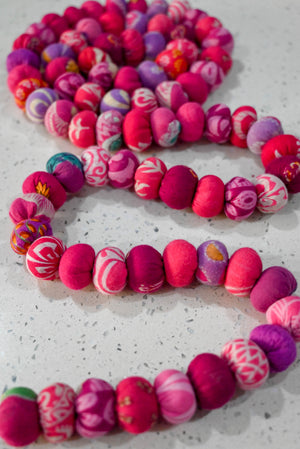 Hand-stitched Saree Bead Garland with vibrant multicolored beads, perfect for home decor, festive decorations, and adding a touch of elegance or boho style to your living room or windows.