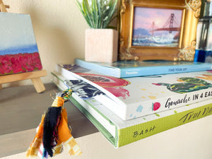 Saree-inspired bookmark with intricate patterns and vibrant fabric, adding a touch of traditional elegance to your reading experience