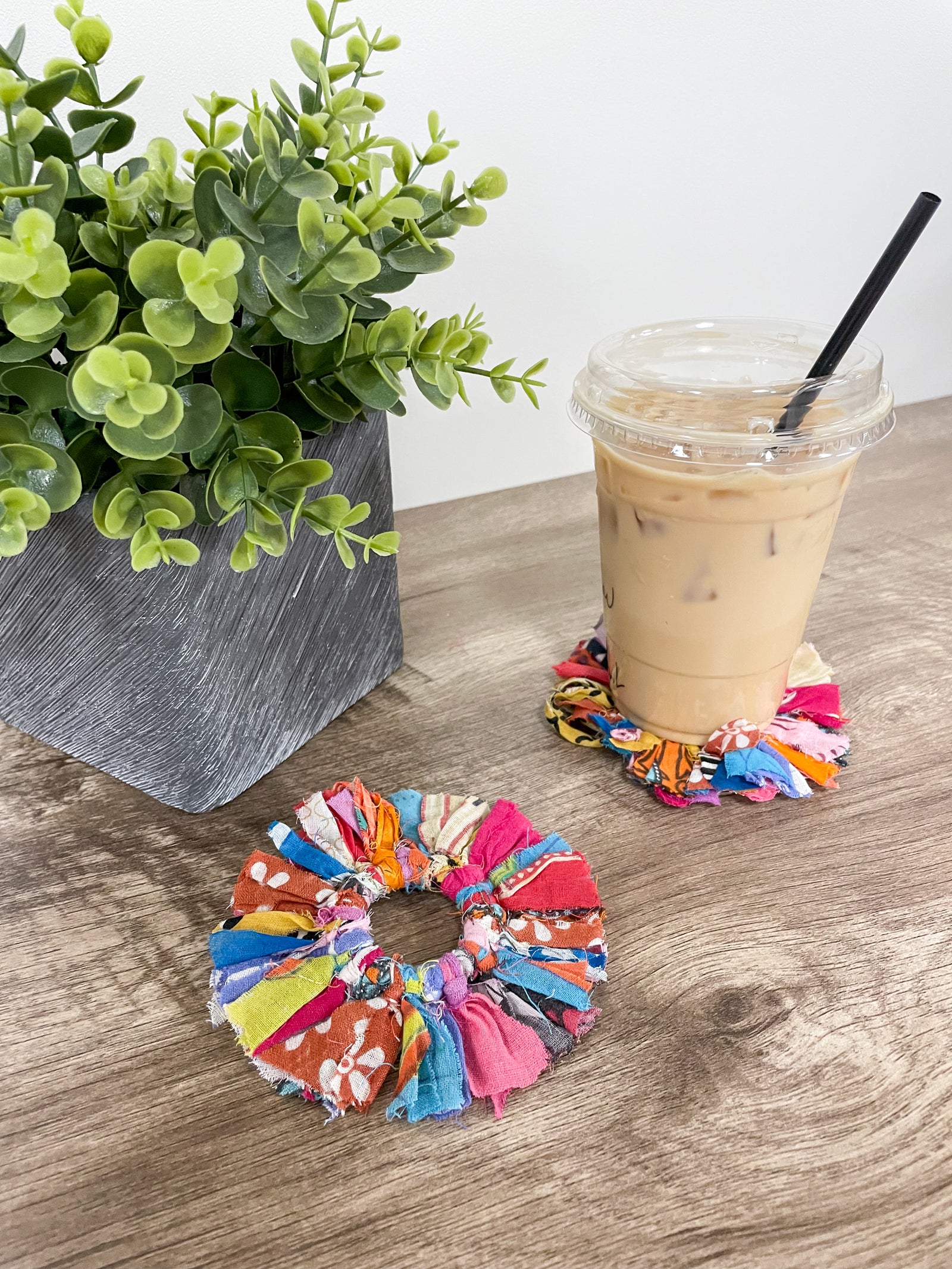 Set of 4 round coasters made from colorful saree scraps, hand-tied to create a vibrant and eco-friendly addition to your home décor.