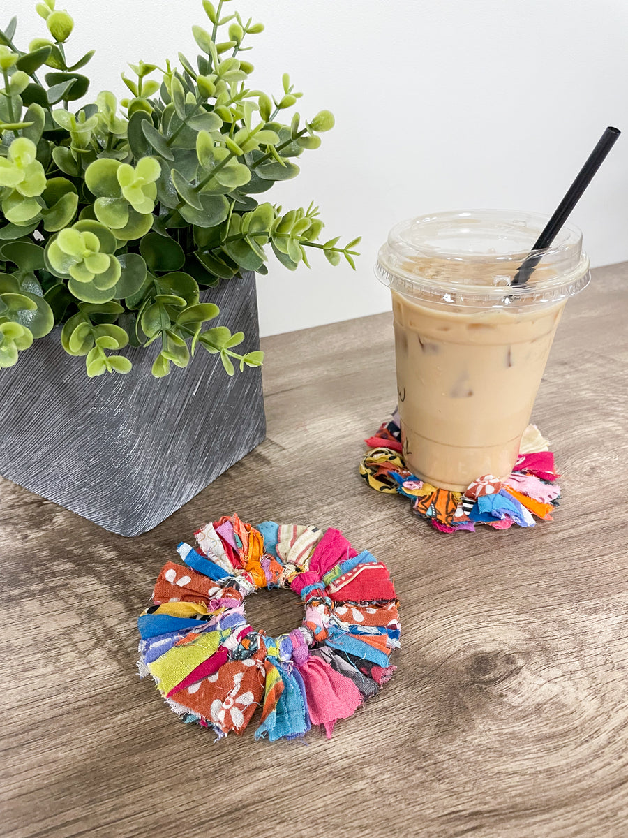 Set of 4 round coasters made from colorful saree scraps, hand-tied to create a vibrant and eco-friendly addition to your home décor.