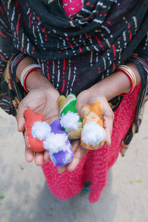 Handmade recycled saree Easter garland featuring vibrant hand-stitched beads and adorable bunnies with fluffy tails, perfect for adding a festive and eco-friendly touch to your Easter decor