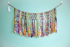 Handmade Saree Macrame Banner, crafted from colorful saree strips, intricately hand-tied to create a unique and vibrant wall decor piece. Perfect for adding a touch of elegance, boho vibes, and cultural flair to any space.