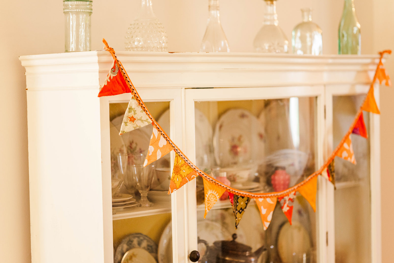 Handmade mini saree triangle banner with vibrant patterns, perfect for adding a festive touch to parties or everyday celebrations with traditional charm.