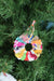 Vibrant Saree Sunburst Ornament, made from colorful saree scraps hand-tied to a ring, creating a bright and beautiful decorative piece perfect for adding a festive touch to your Christmas tree