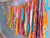 Colorful Saree Wall Hanging made from long strips of vibrant saree fabric, expertly crafted to bring a burst of color and charm to your space.