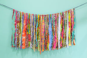 Colorful Saree Wall Hanging made from long strips of vibrant saree fabric, expertly crafted to bring a burst of color and charm to your space.