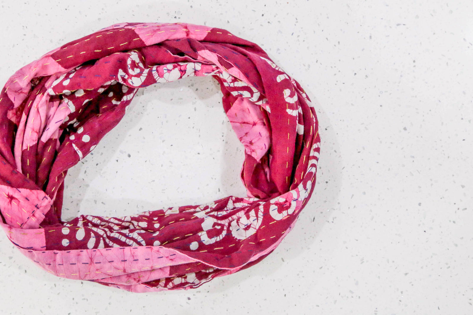 Handmade Kantha infinity scarf with vibrant stitching and beautiful saree patterns, offering a stylish and cozy accessory for year-round wear.