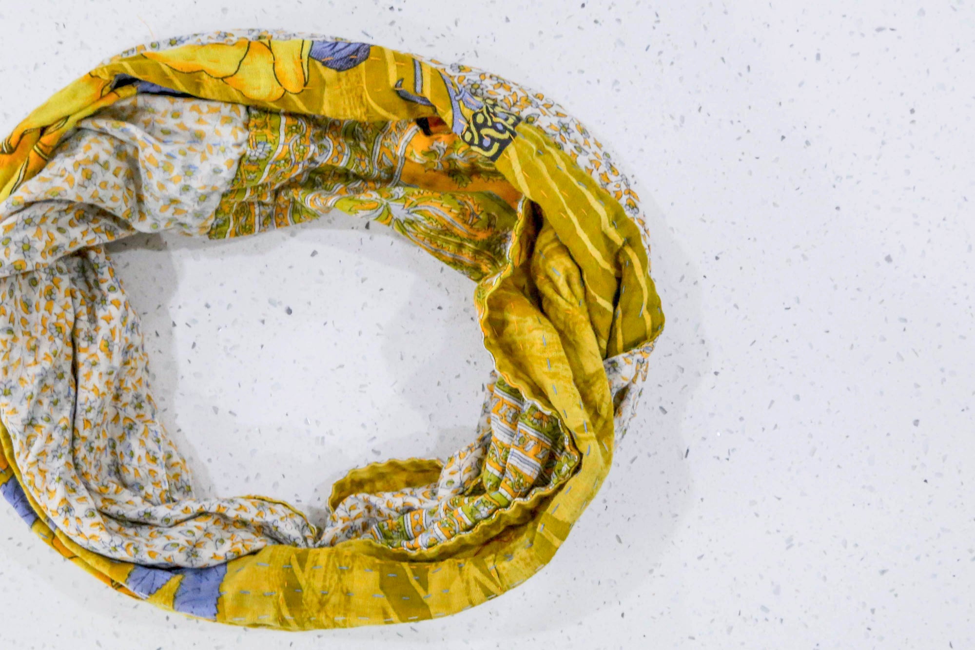 Handmade Kantha infinity scarf with vibrant stitching and beautiful saree patterns, offering a stylish and cozy accessory for year-round wear.