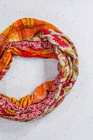 Handmade Kantha infinity scarf with vibrant stitching and beautiful saree patterns, offering a stylish and cozy accessory for year-round wear.
