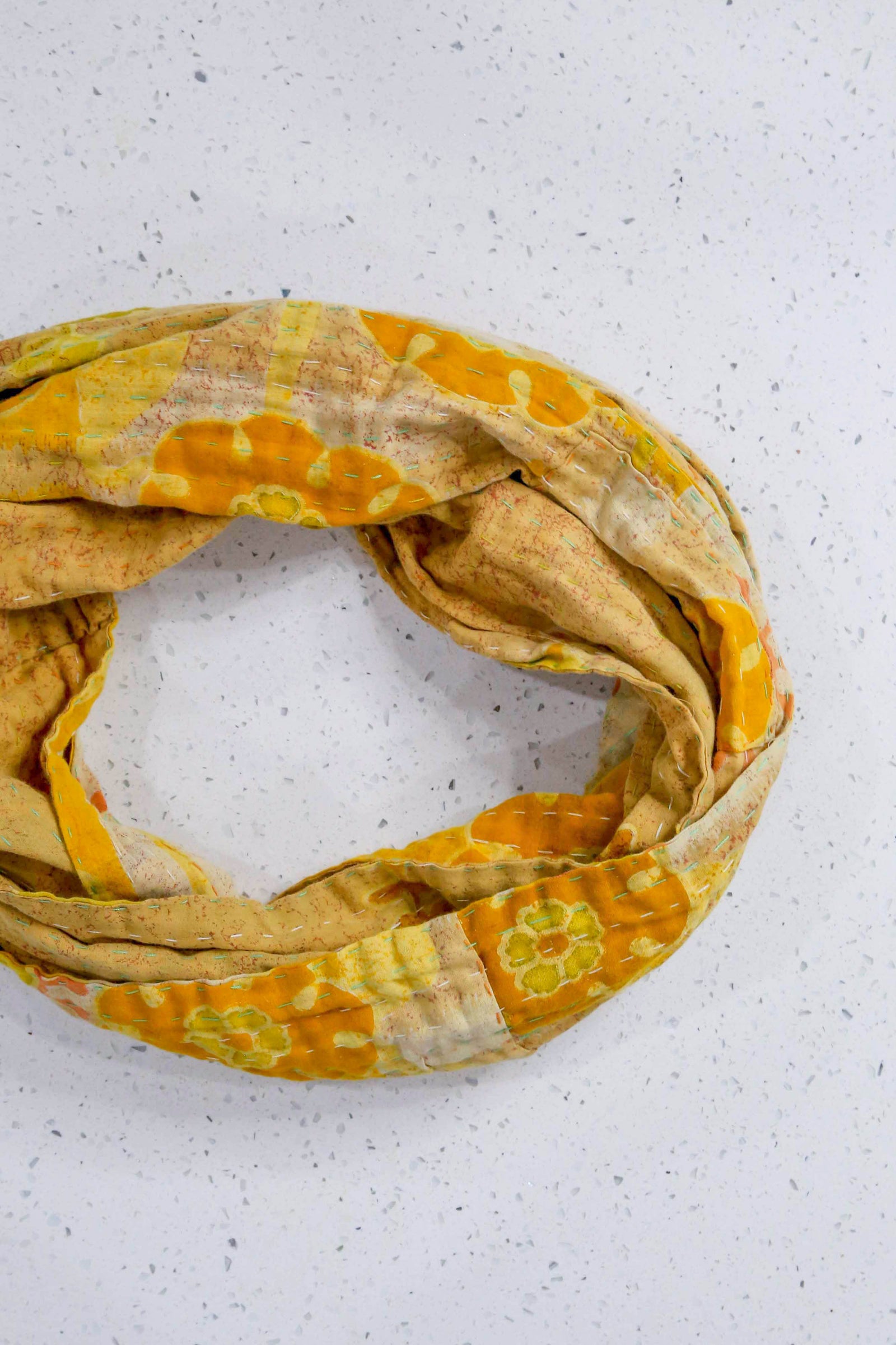 Handmade Kantha infinity scarf with vibrant stitching and beautiful saree patterns, offering a stylish and cozy accessory for year-round wear.