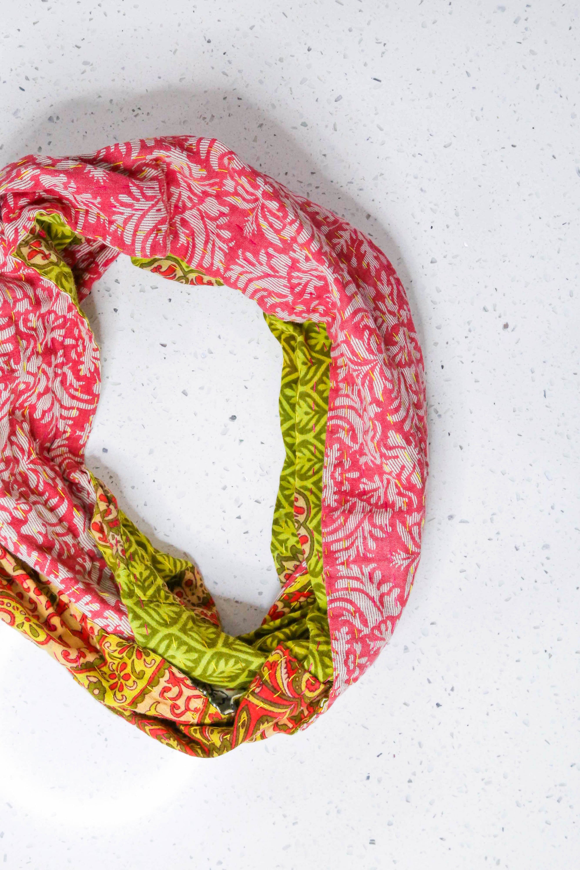 Handmade Kantha infinity scarf with vibrant stitching and beautiful saree patterns, offering a stylish and cozy accessory for year-round wear.